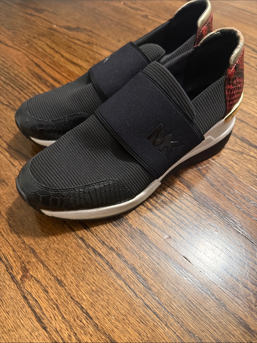 Michael Kors Black Slip-On Sneakers with Red Heel Detail